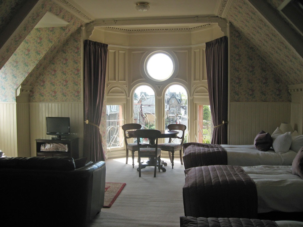 Characterful guest room with seating area